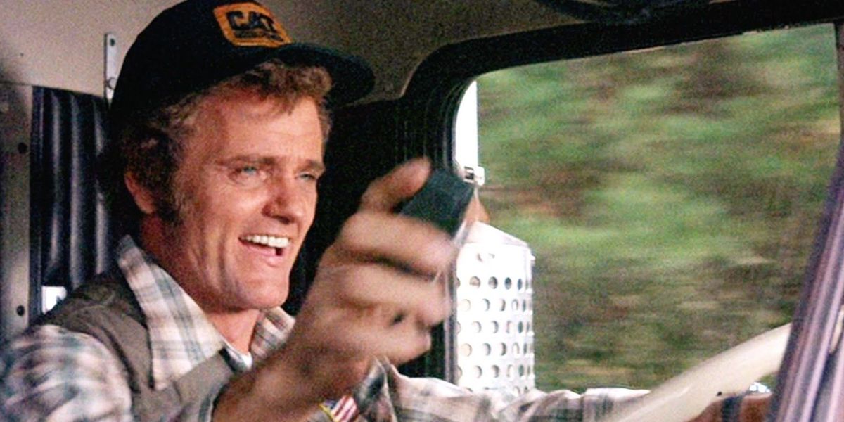 Jerry Reed smiling while driving a truck in Smokey and the Bandit