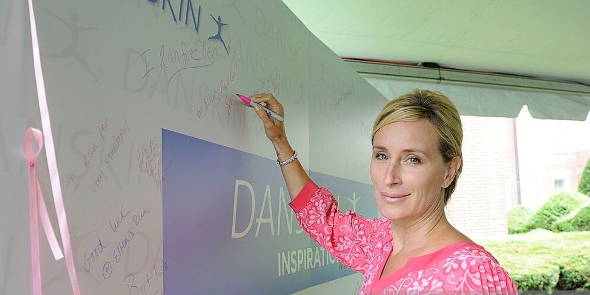 Sonja Morgan standing by a sign for charity on RHONY