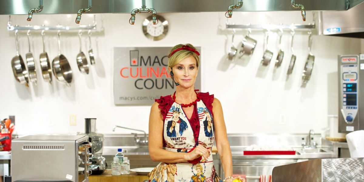 Sonja Morgan standing in front of a demo for toaster ovens 