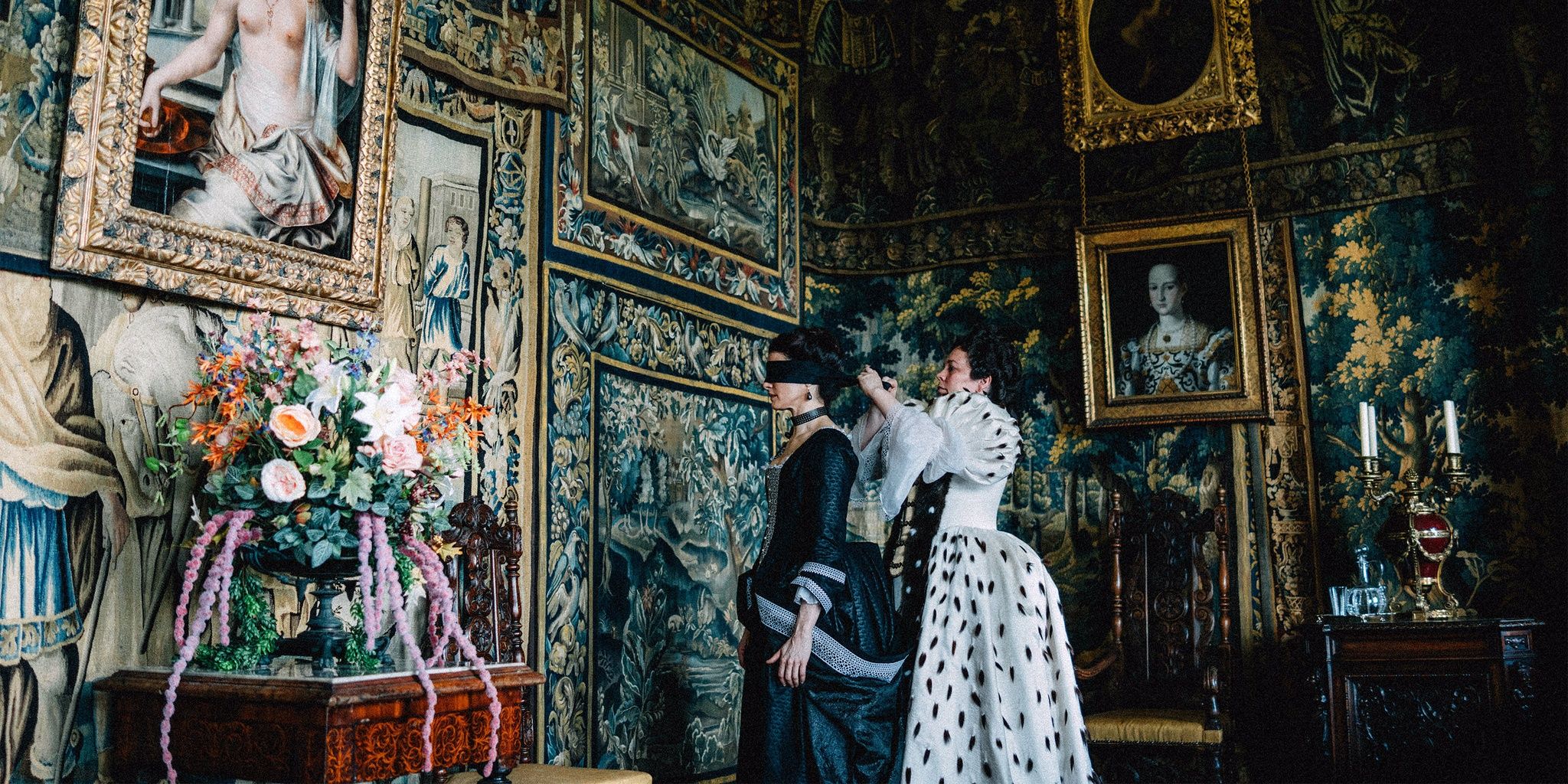 Characters in a lavish room in The Favourite