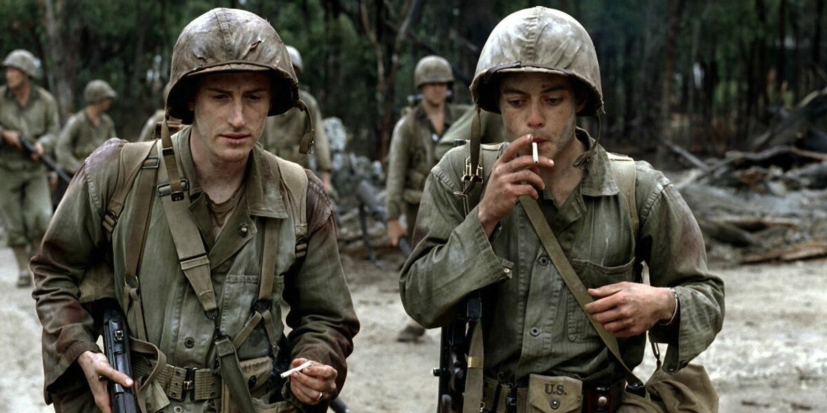 Two soldiers smoking a cigarette while on tour in The Pacific