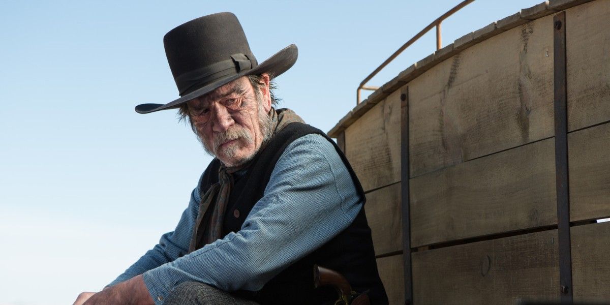 George Briggs (Tommy Lee Jones) riding a wooden wagon in The Homesman