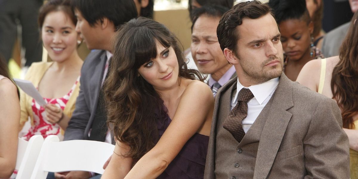 Jess and Nick sit together in the New Girl episode 
