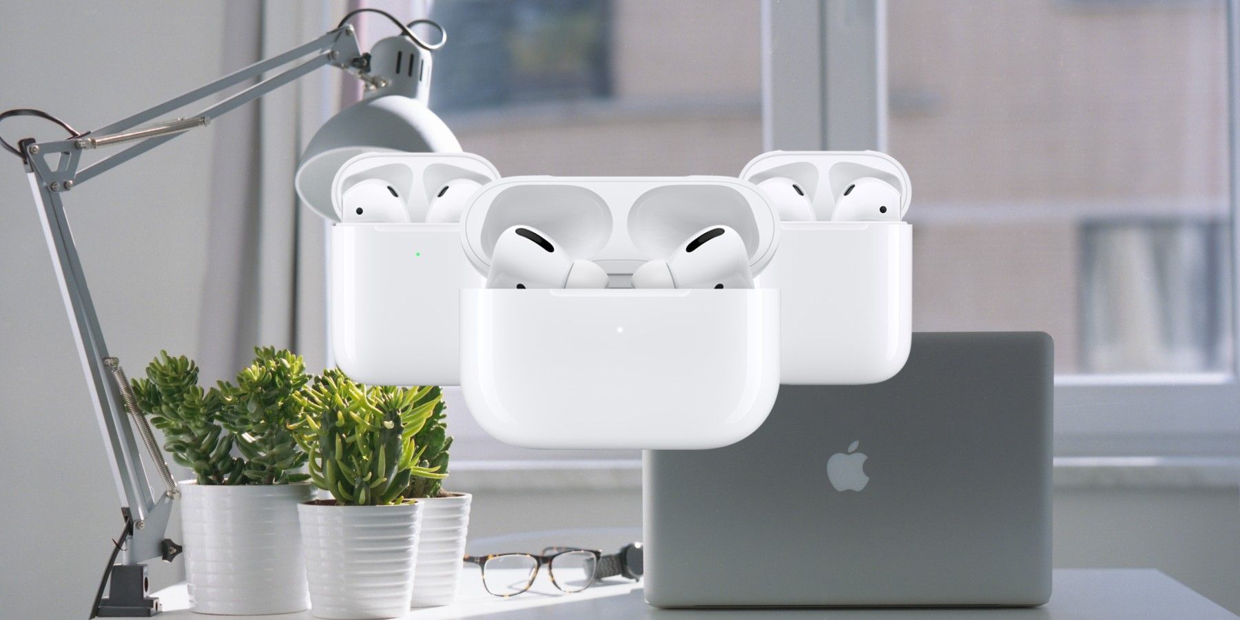 Airpods in front of a MacBook