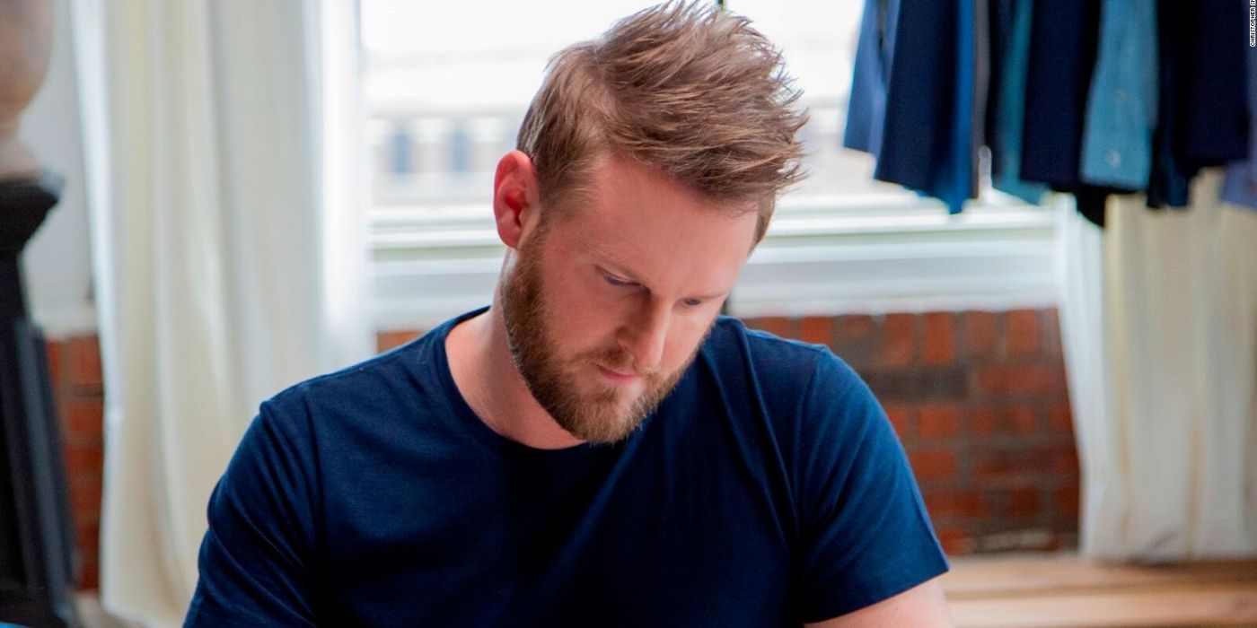 bobby berk concentrating on his work on queer eye