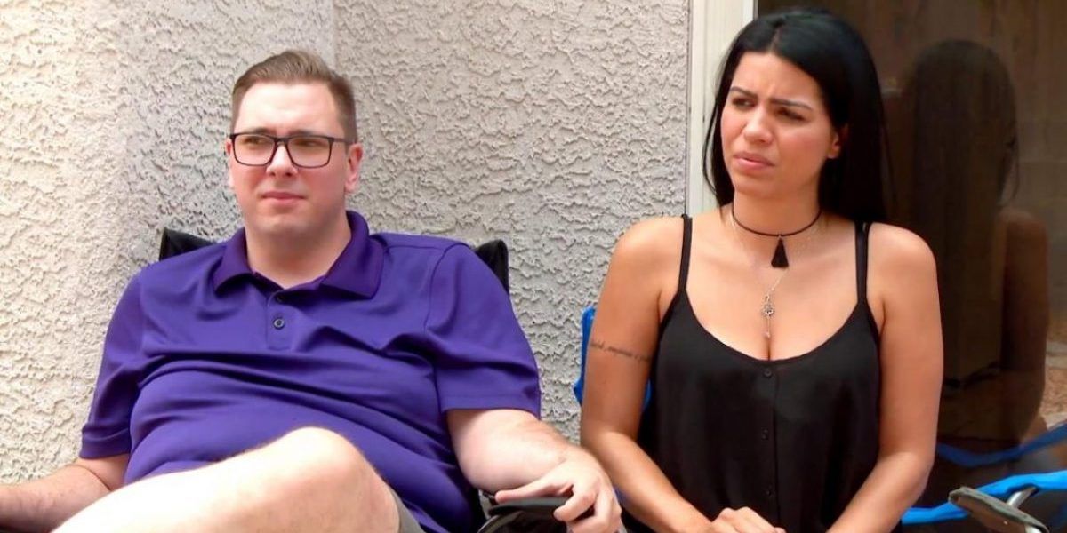 Colt and Larissa sitting outside looking uncomfortable in 90 Day Fiance