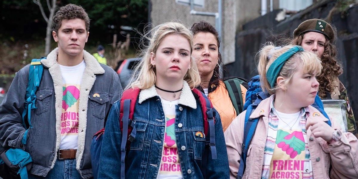 James, Erin, Michelle, Clare, and Orla stand together for the Across the Barricade program in Derry Girls
