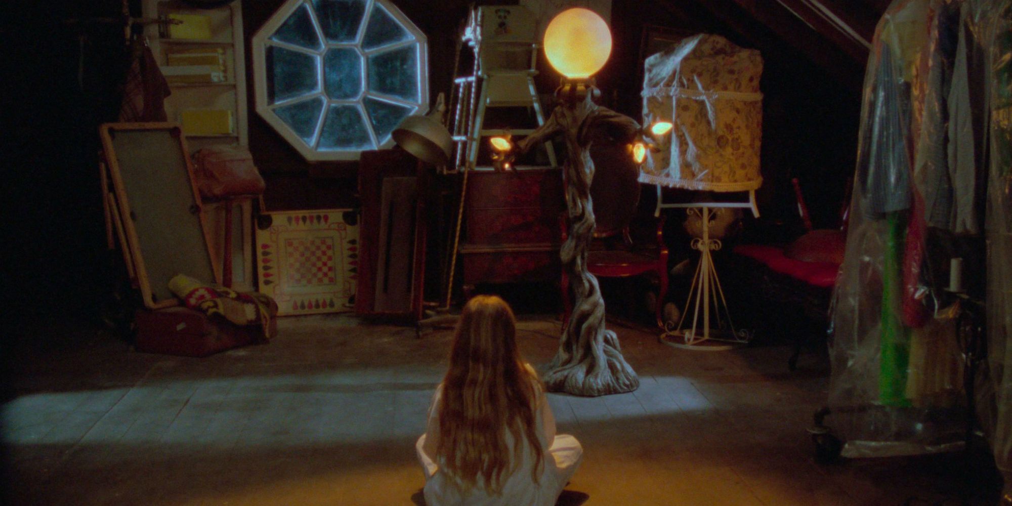 A little girl sits next to a possessed lamp in Amityville 4