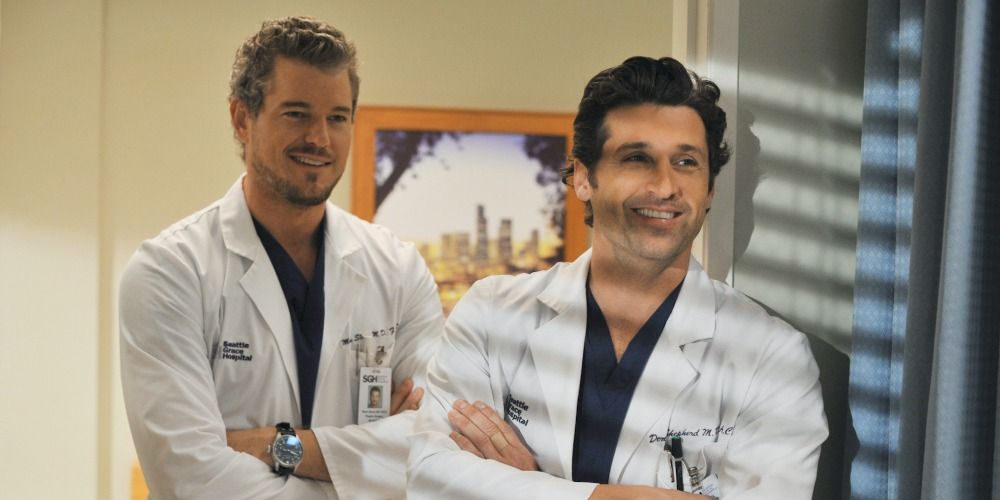 An image of Mark and Derek laughing together in Grey's Anatomy