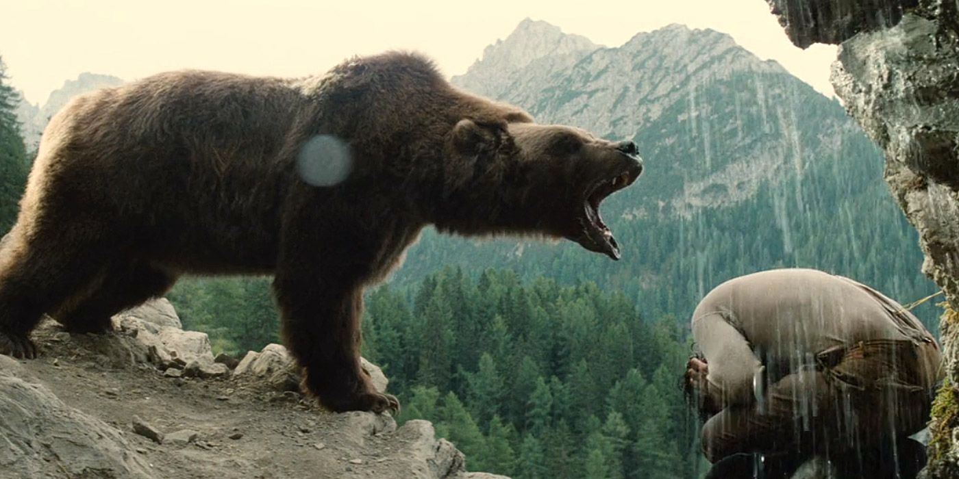 A giant Kodiak bear roars at a human hunter in The Bear