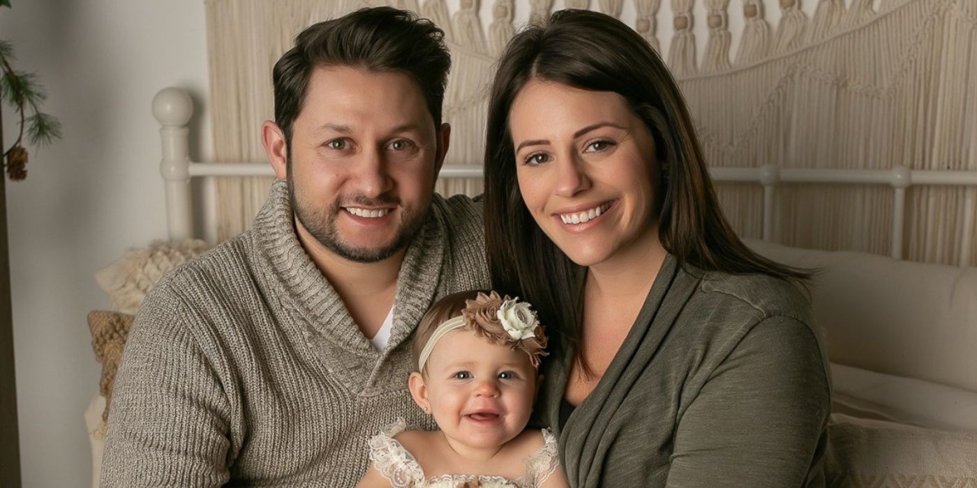 Ashley and Anthony Married At First Sight-2 posing with baby daughter in nursurey