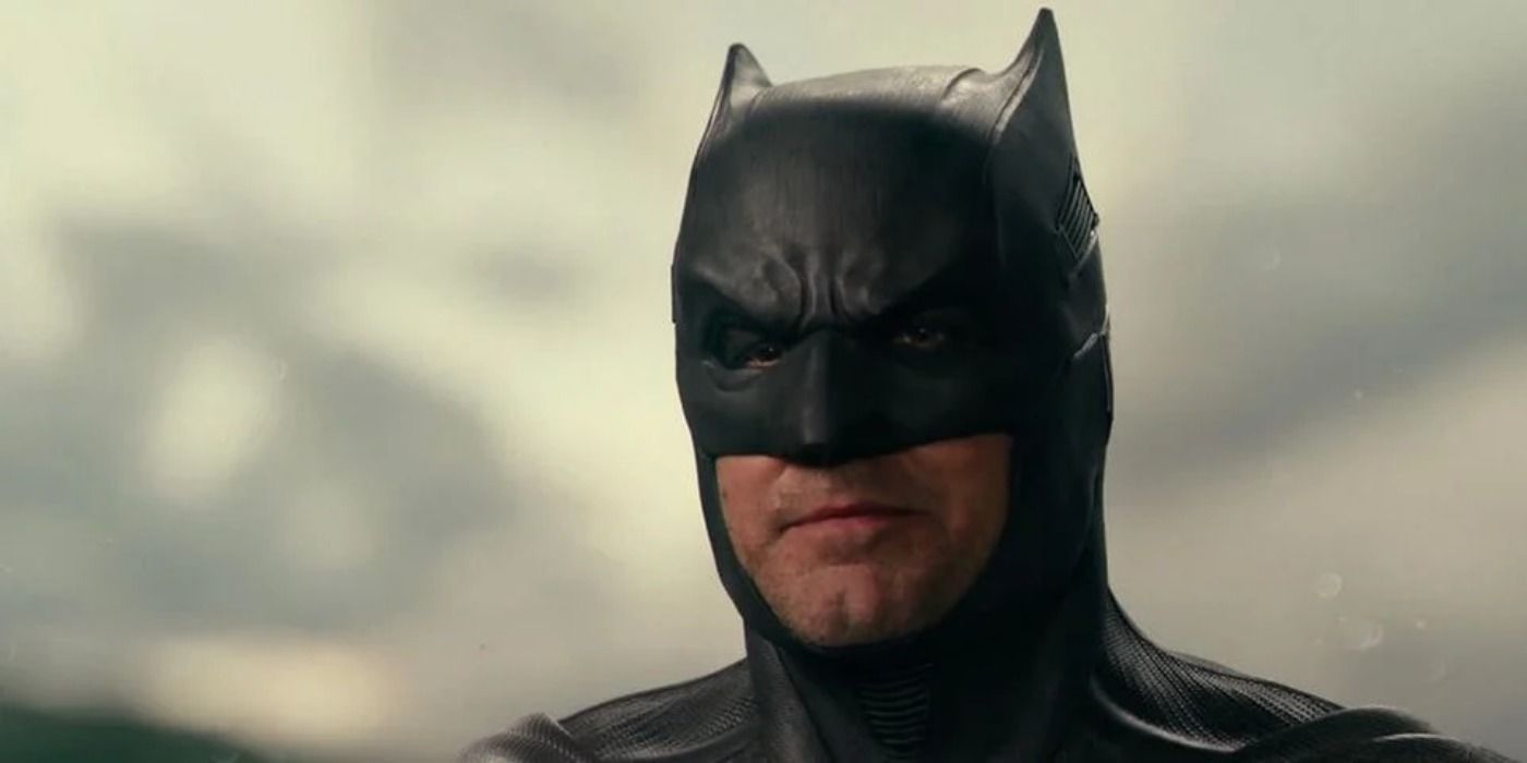 Ben Affleck looking at something as Batman.