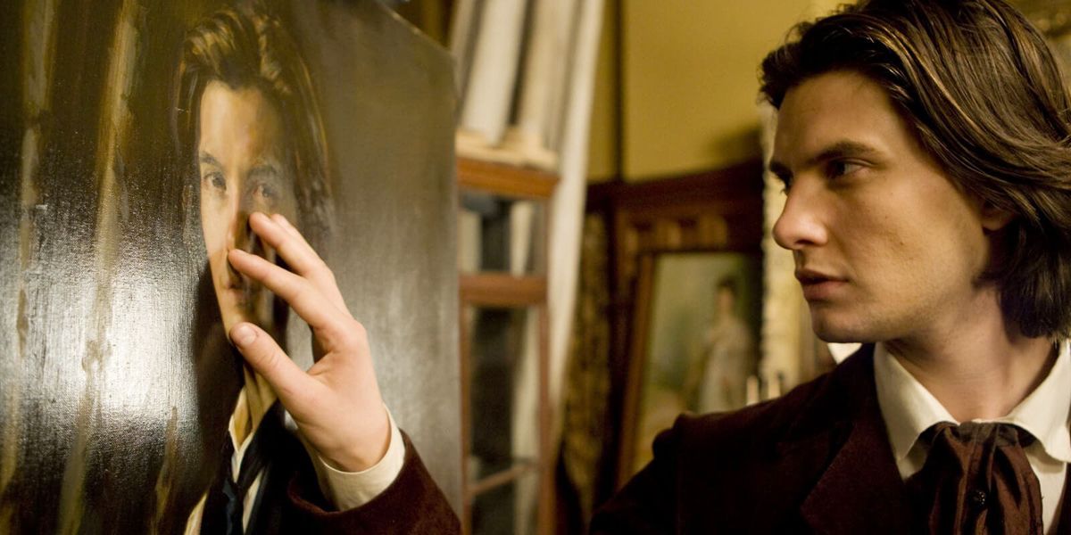 An image of Dorian Gray touching his portrait in the movie