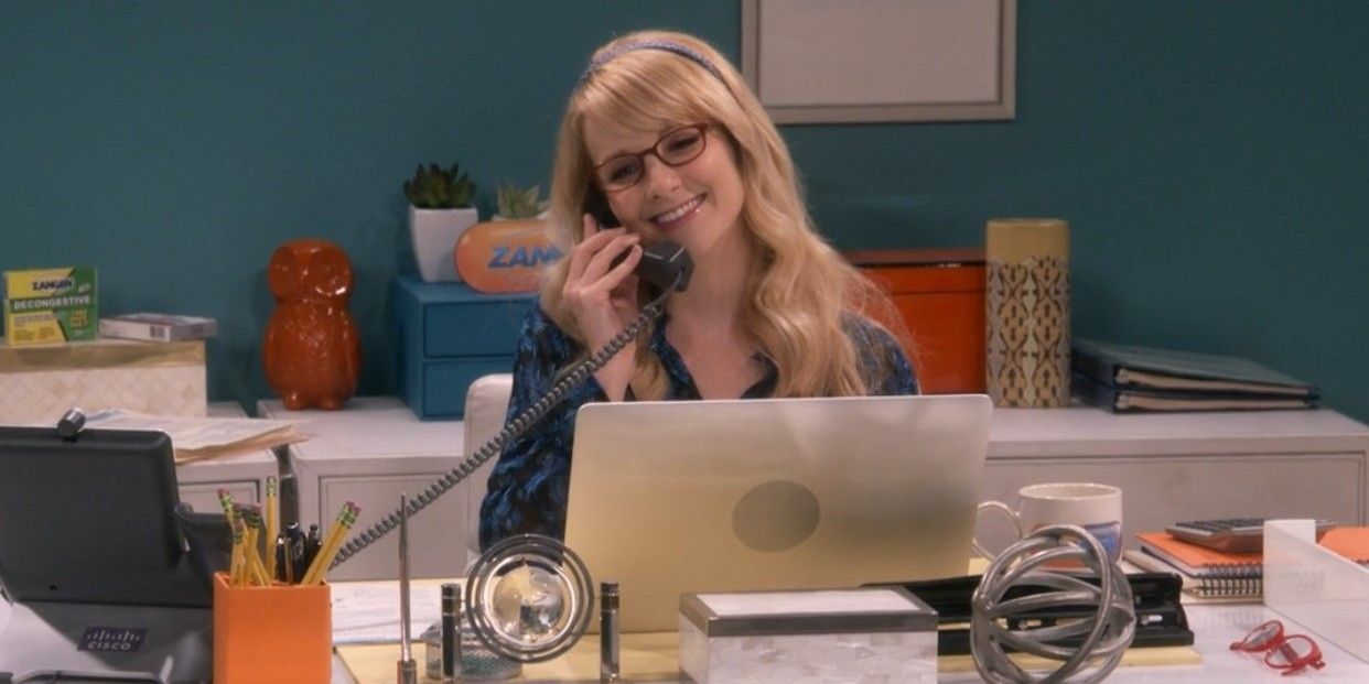 Bernadette sitting behind her desk in The Big Bang Theory