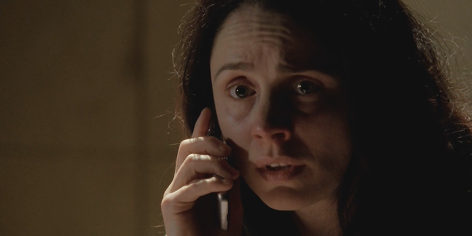 Lydia on the phone in a scene from Breaking Bad, looking terrified.