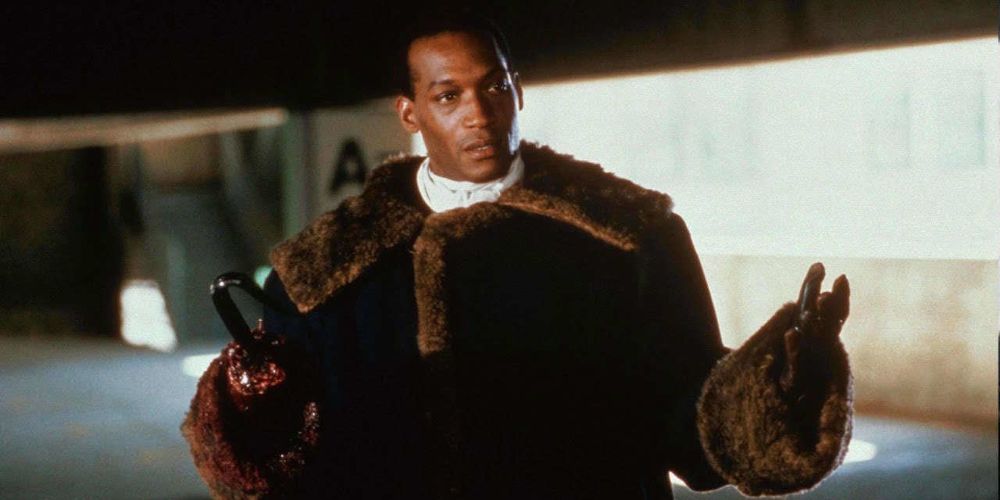 The Candyman stands with his arms outstretched from Candyman