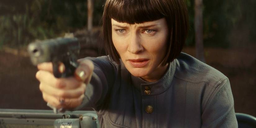 Cate Blanchett pointing a pistol in Indiana Jones and the Kingdom of the Crystall Skull