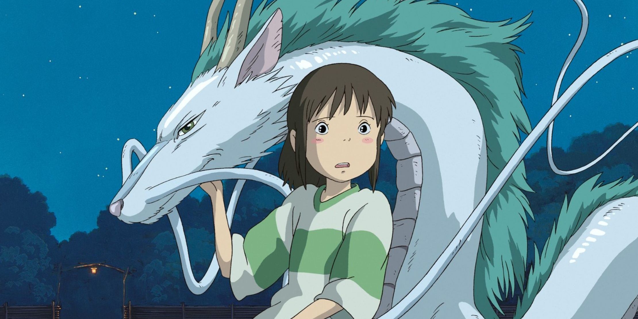 Chihiro holding Haku in his dragon form.