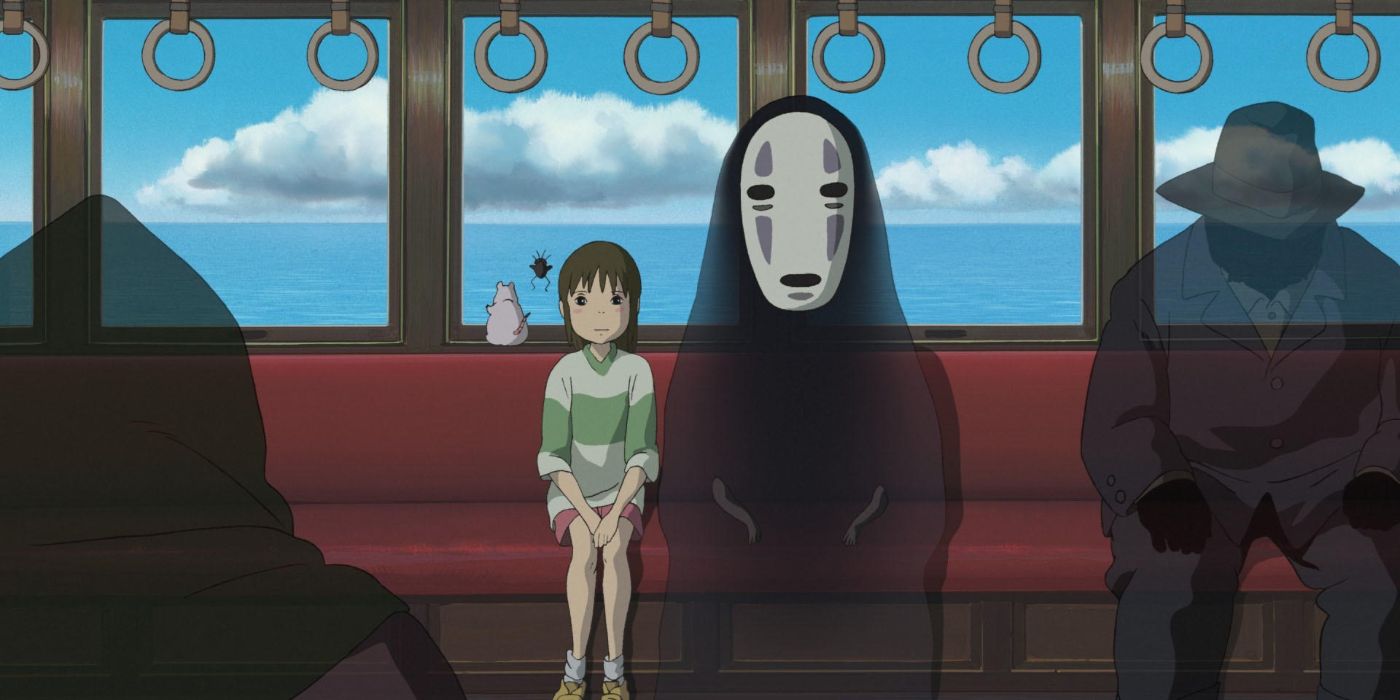 Chihiro and No Face on the train in Spirited Away