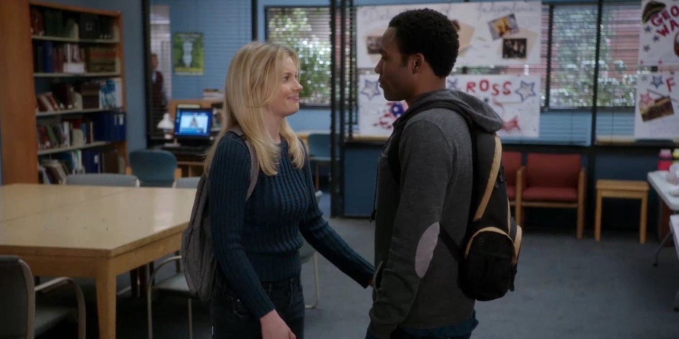 Britta and Troy talking and holding hands in Community.