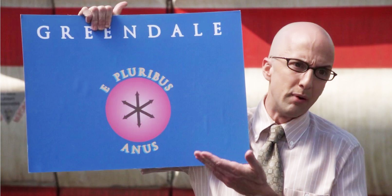 Craig holding the Greendale flag in Community