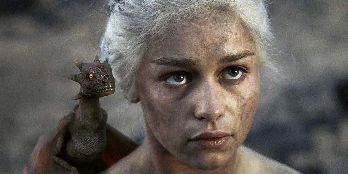 A baby dragon on Daenerys' shoulder in the season 1 finale of Game of Thrones