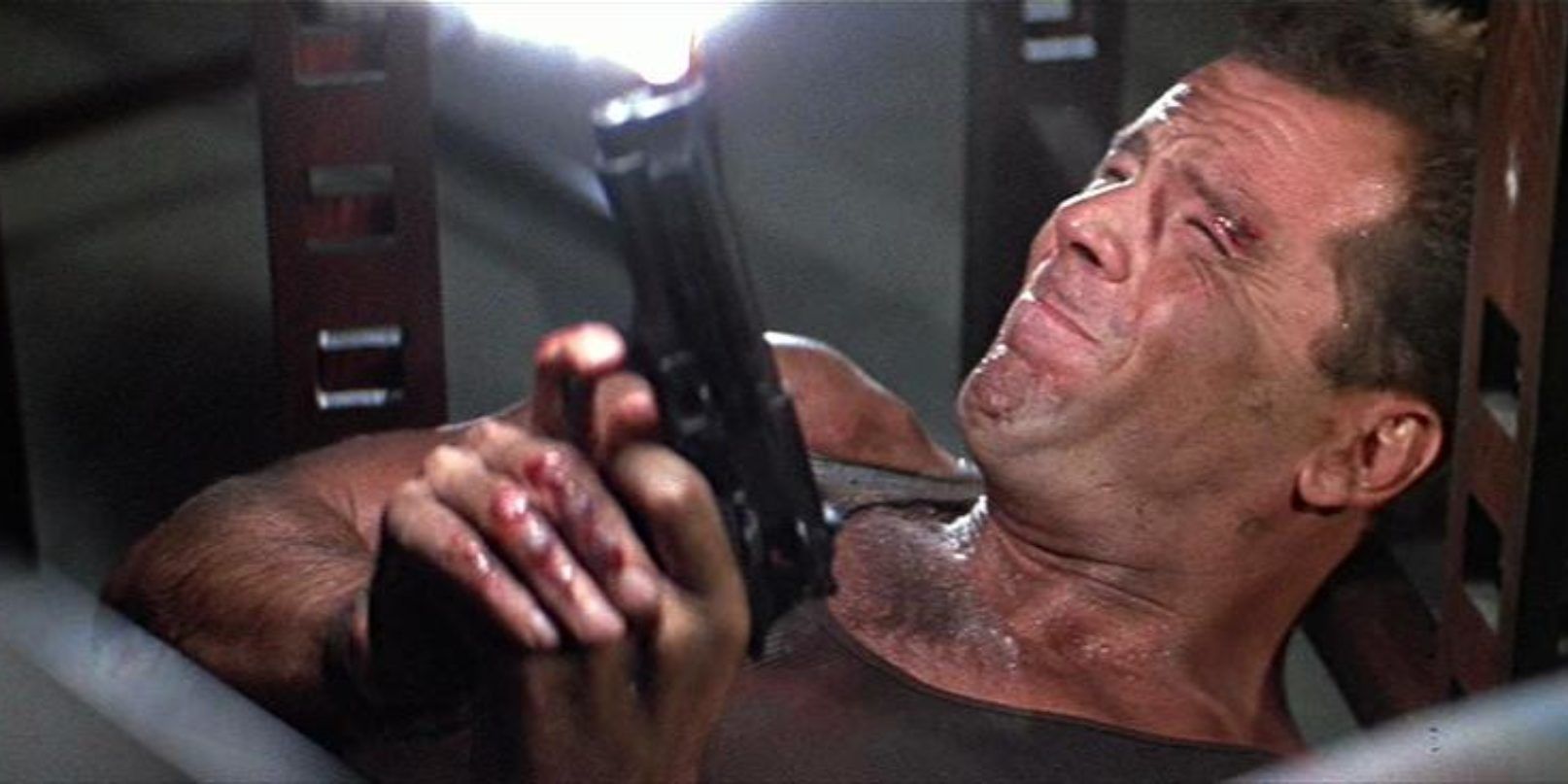 John McClane lying on his back and firing upward in Die Hard