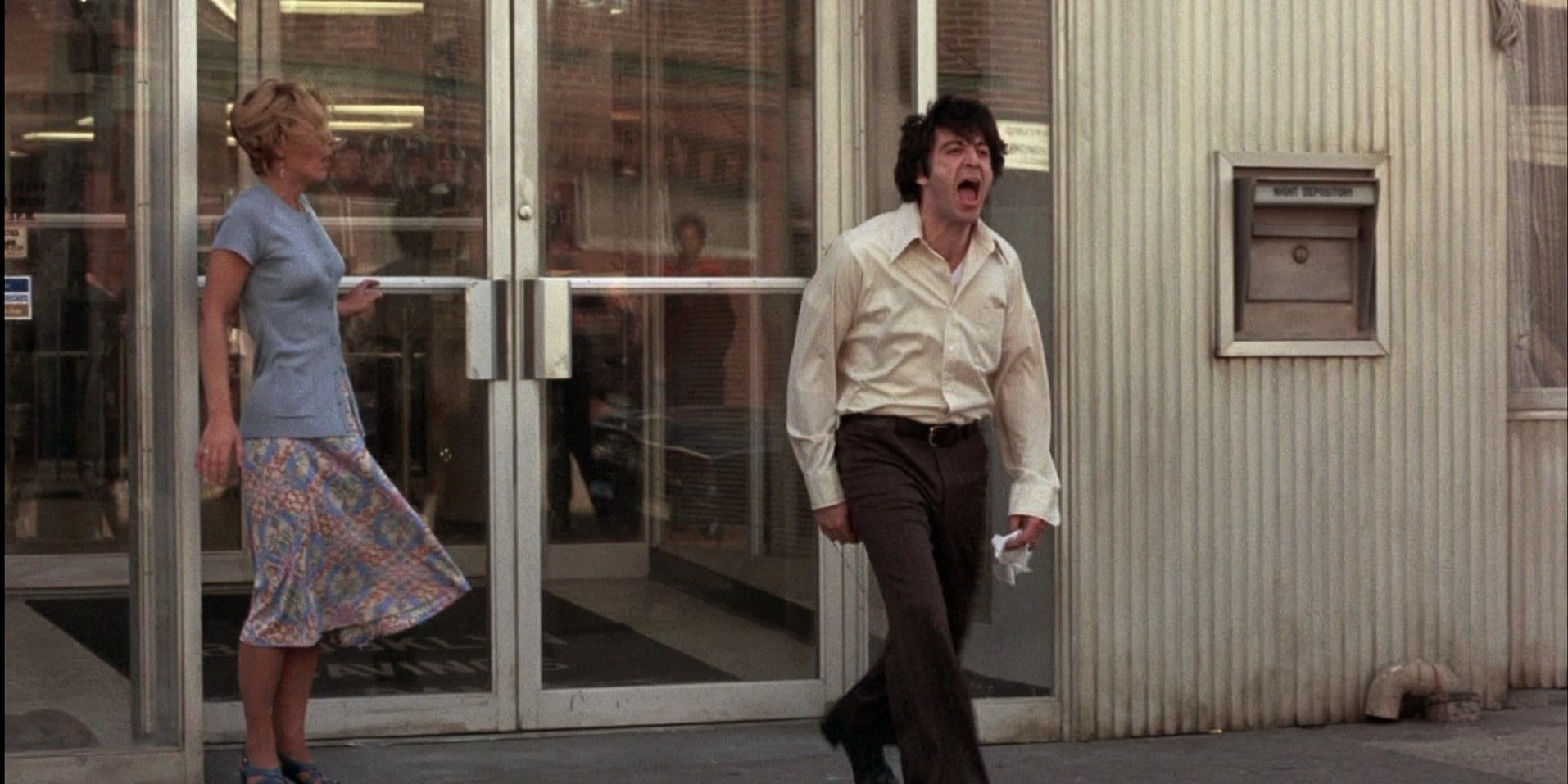 An image of Sonny walking away from a store in Dog Day Afternoon