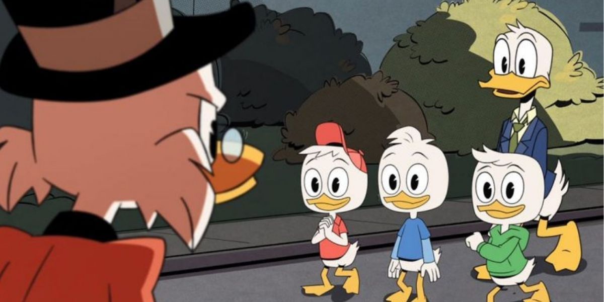 Scrooge glaring at Huey, Duey, Luey and Donald Duck in Ducktales