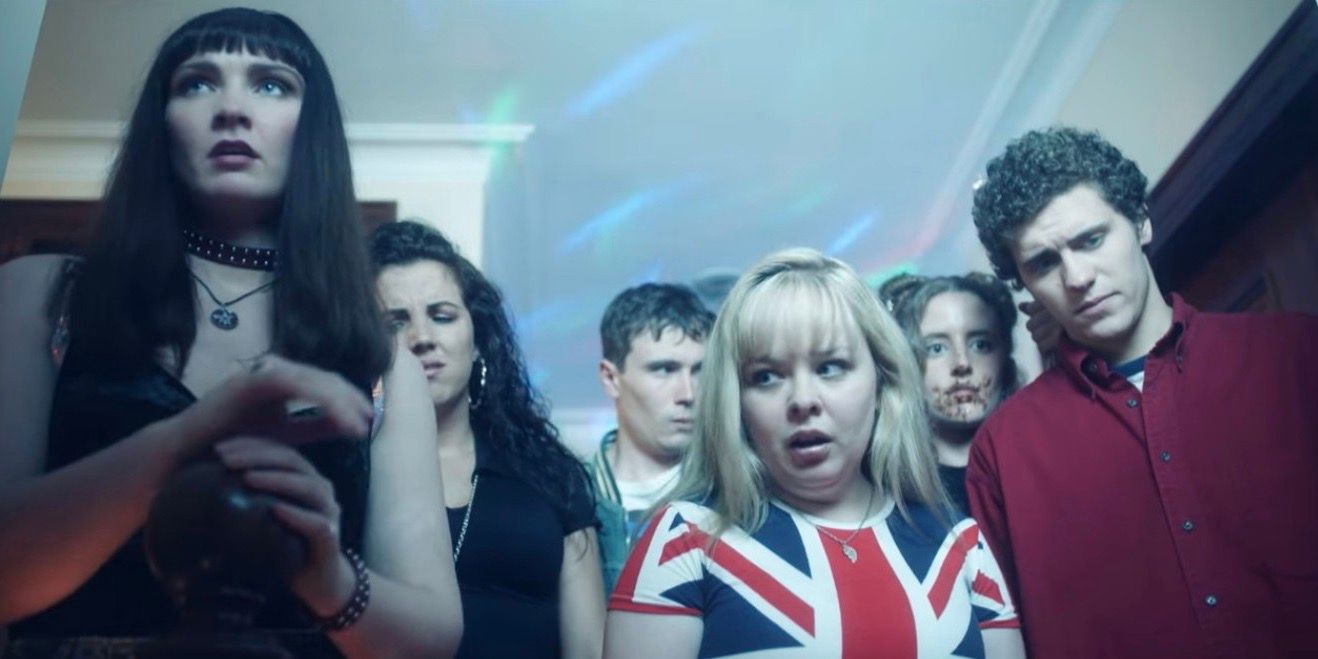 Katya stands with Michelle, Clare, James, and other students in Derry Girls Season 1