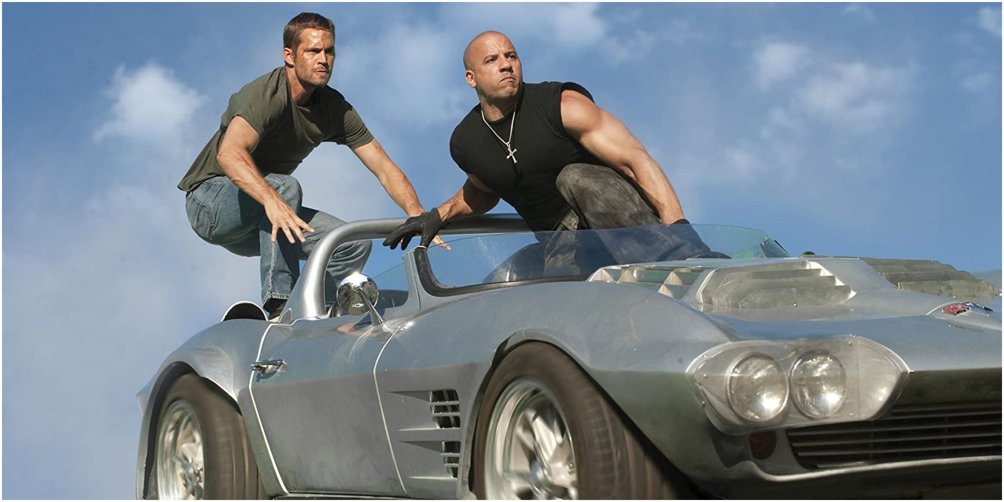 Dom and Brian jump out of a car that's about to dive into a lake in Fast Five