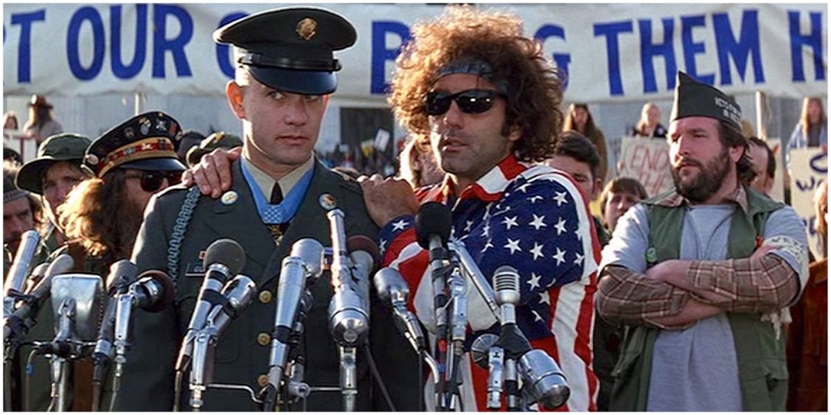 Forrest standing in front of several microphones at an anti-war rally in Forrest Gump
