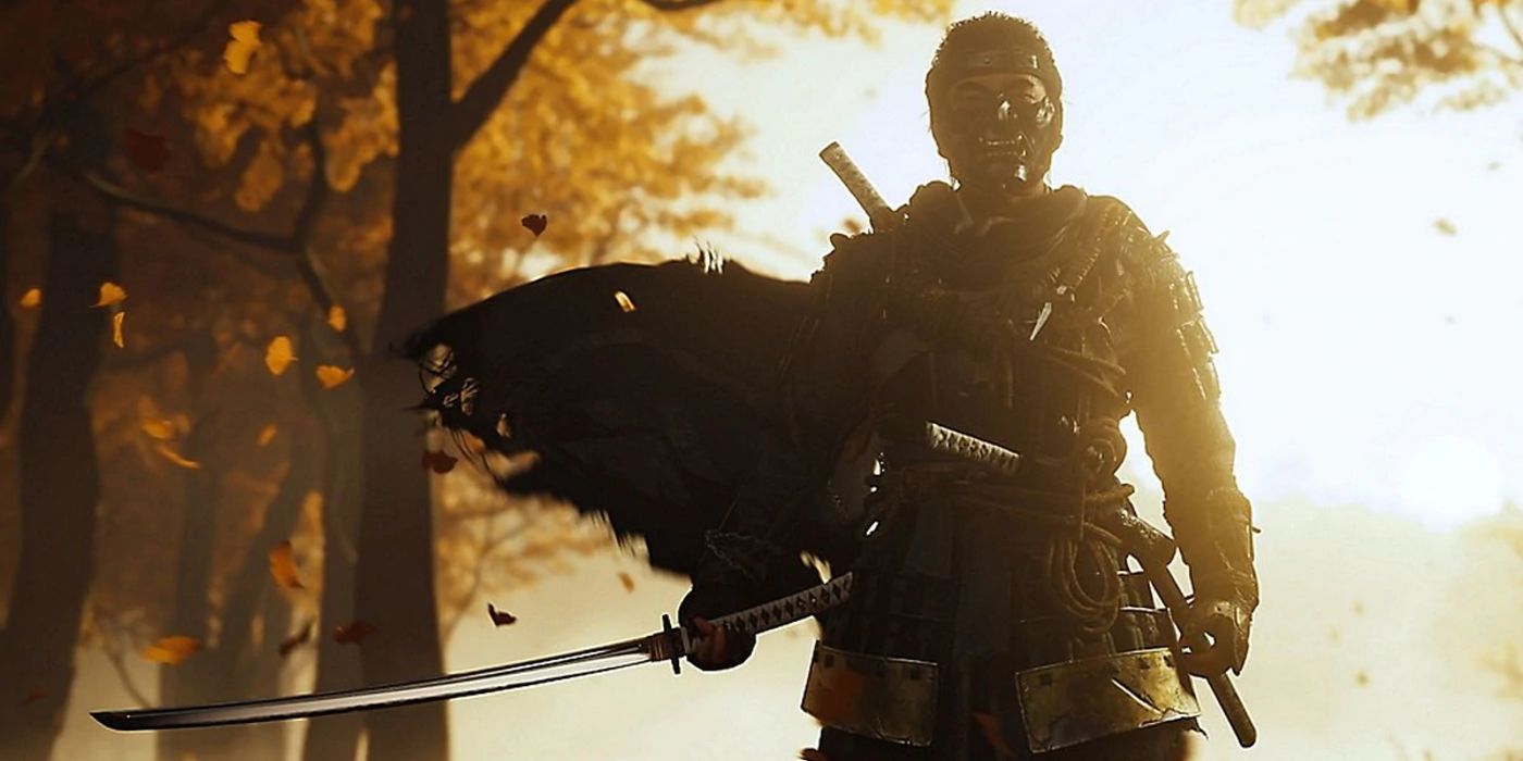 A backlit Jin Sakai stands in an autumnal forest and draws his sword in Ghost Of Tsushima
