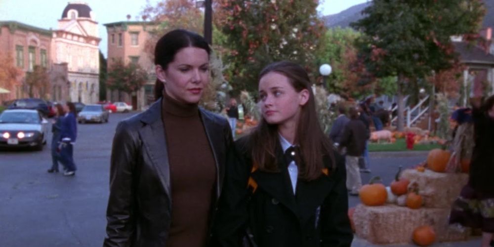 Rory and Lorelai stroll throughout Stars Hollow on Gilmore Girls
