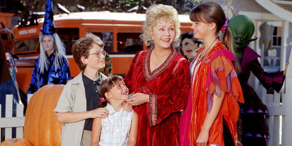 The Piper children smiling with Aggie outside in Halloweentown 