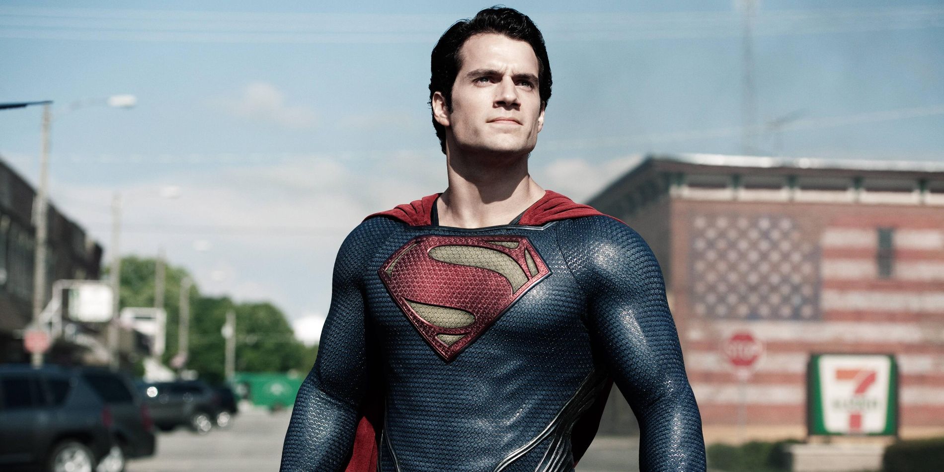 Henry Cavill as Superman stands on a Smallville street