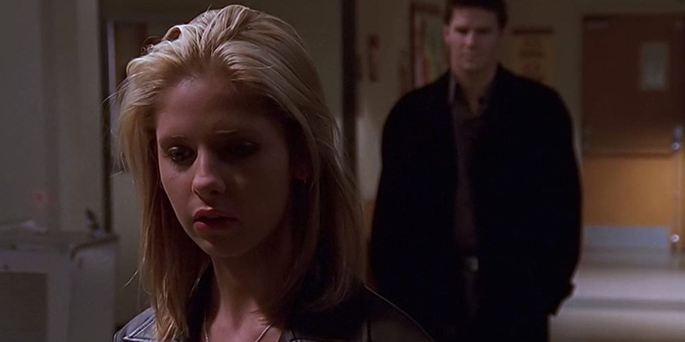 Angel standing behind Buffy on Buffy The Vampire Slayer
