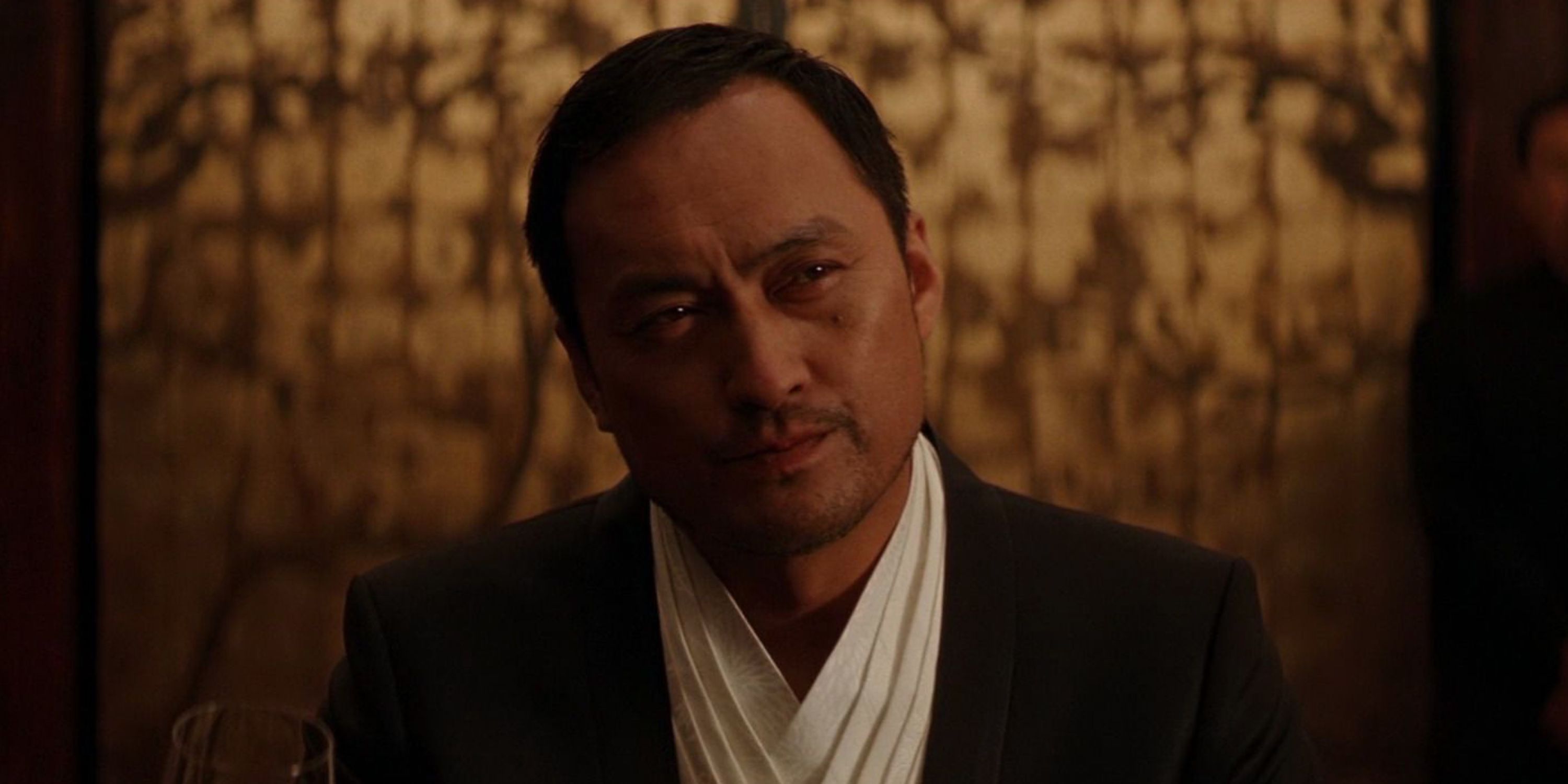 Saito looking serious in Inception