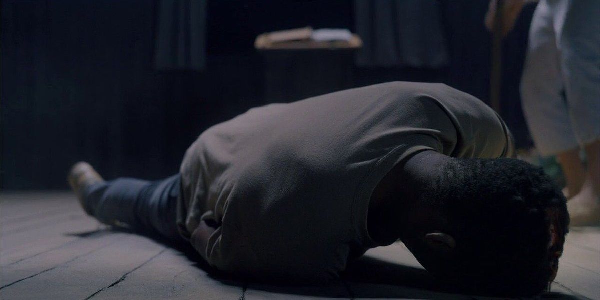 Josh on the floor of a barn in Midsommar