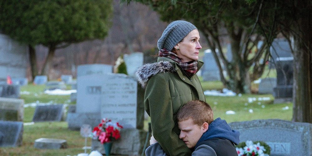 Lucas Hedges hugs Julia Roberts in a graveyard in Ben is Back