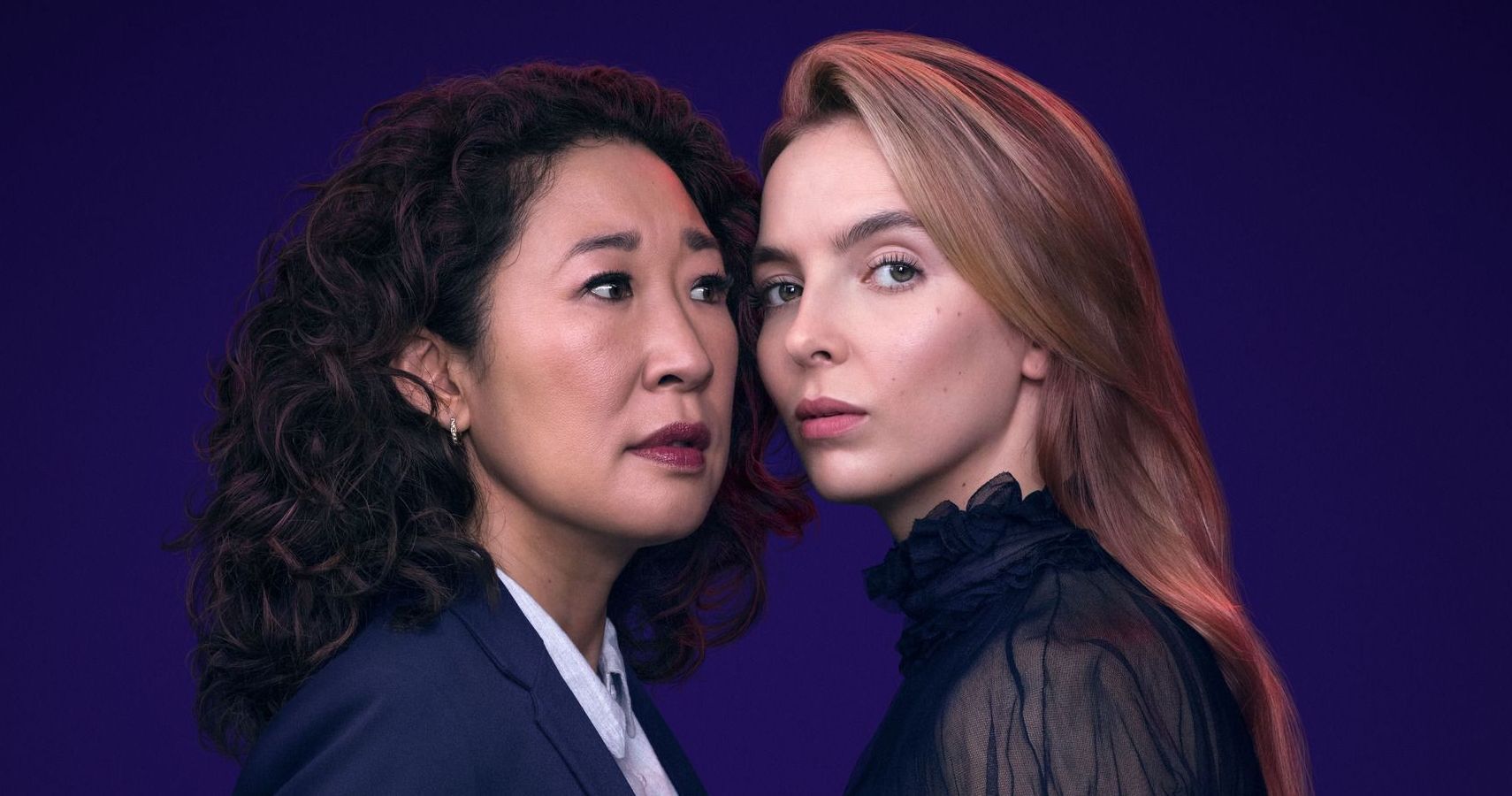 Sandra Oh and Jodie Comer posing next to each other in Killing Eve
