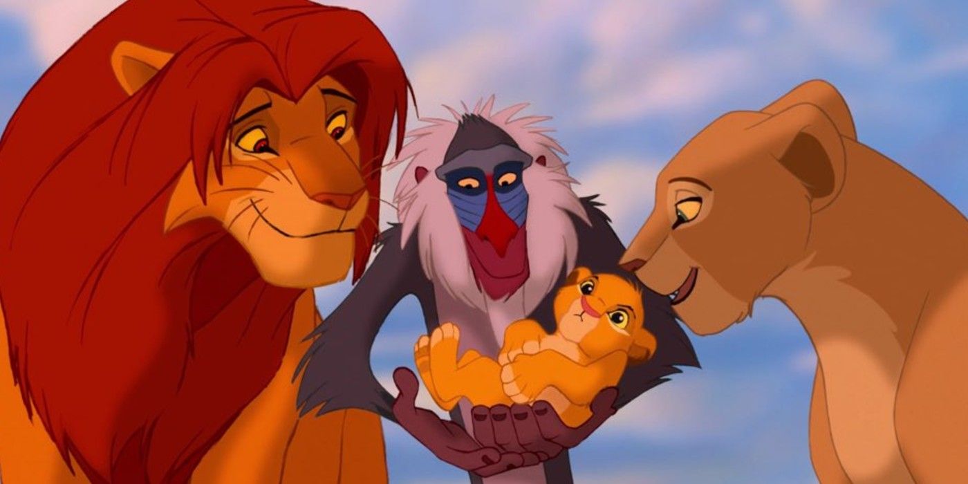 Simba, Nala, and Rafiki hold a cub in The Lion King.