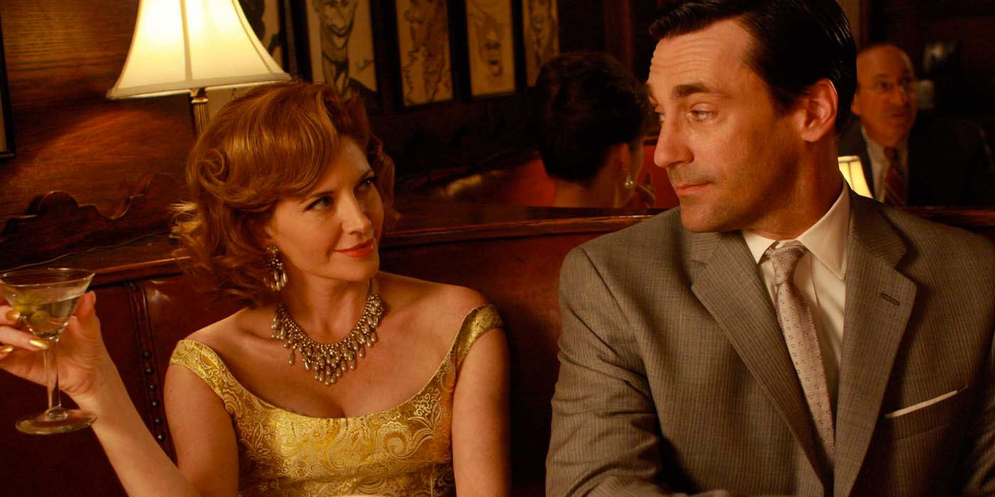 Don abd Bobbie smile at each other in a bar in Mad Men