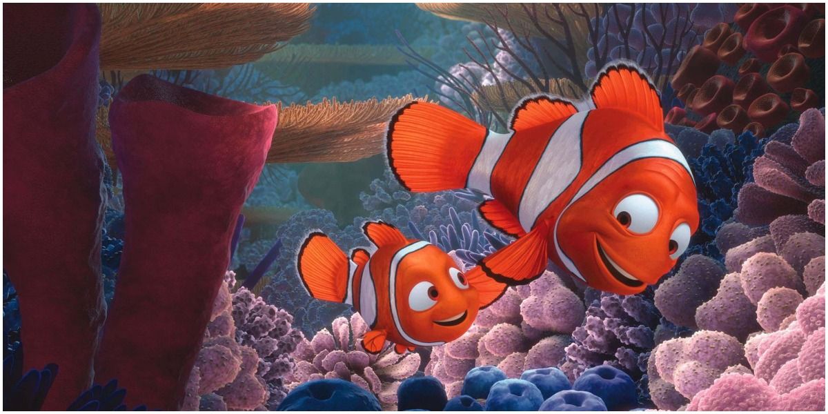 Marlin holds Nemo's fin as they swim