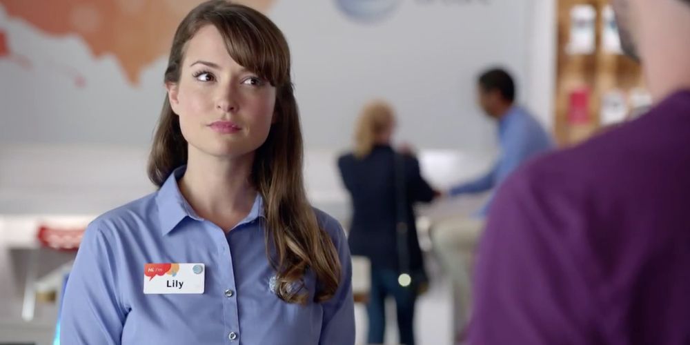 Milana Vayntrub looks confused as she sells a phone as an AT&amp;T rep