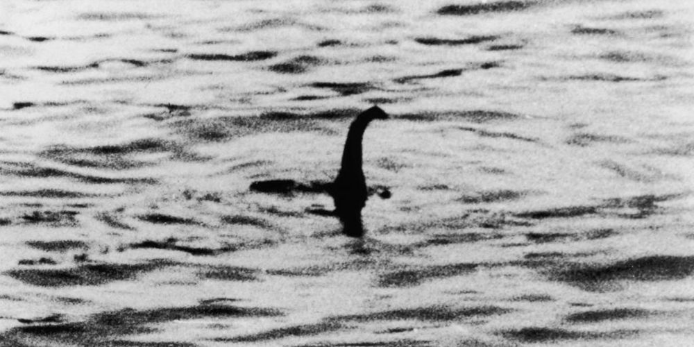 Nessie swims through Loch Ness.