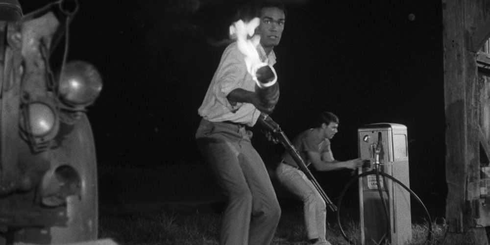 Duane Jones brandishing a torch in Night of the Living Dead