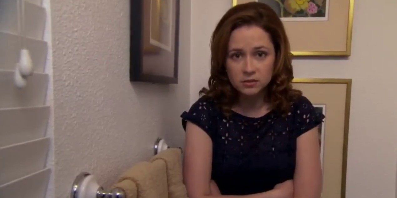 Pam hides out in the bathroom at a dinner party in The Office
