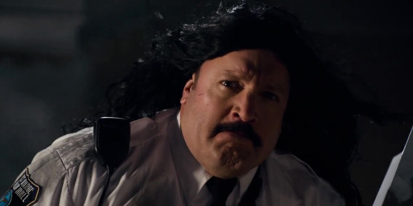 Paul Blart wearing a long black wig