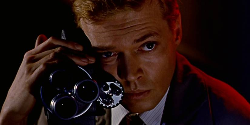 Close up of Mark Lewis with the camera he is using to film women.